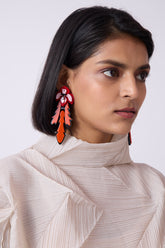 earrings in red color with orange-toned accents